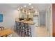 The kitchen features white cabinets, stainless appliances and a breakfast bar at 117 7Th N St # 35, Bradenton Beach, FL 34217