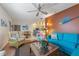 Open concept living room with seating and view of the kitchen at 117 7Th N St # 35, Bradenton Beach, FL 34217