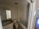 Bathroom featuring a vanity, toilet, and tub/shower combo with tile surround at 11811 53Rd Ct E, Parrish, FL 34219