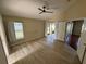 Spacious bedroom features a ceiling fan, wood flooring, and a sliding glass door to the outside at 11811 53Rd Ct E, Parrish, FL 34219