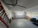 Spacious two-car garage with an automatic door and a ladder at 11811 53Rd Ct E, Parrish, FL 34219