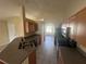 Modern kitchen featuring stainless steel appliances, tile floor, and open concept design at 11811 53Rd Ct E, Parrish, FL 34219