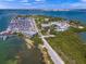 Aerial view of a marina, research facilities, and roadways with waterfront views of Sarasota at 1186 Center Pl, Sarasota, FL 34236