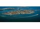 Expansive aerial of an island community with waterfront homes, canals and boats at 1186 Center Pl, Sarasota, FL 34236
