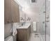Contemporary bathroom featuring a glass-enclosed shower, modern vanity, and minimalist finishes at 1186 Center Pl, Sarasota, FL 34236