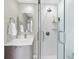 Modern bathroom featuring a glass-door shower and sleek vanity with a stylish mirror at 1186 Center Pl, Sarasota, FL 34236