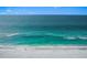 Scenic aerial view of the beach with turquoise water, showcasing a serene and inviting coastal escape at 1186 Center Pl, Sarasota, FL 34236