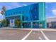 Exterior view of Mote Aquarium's colorful building with ample parking and pedestrian walkways at 1186 Center Pl, Sarasota, FL 34236