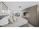 Calm main bedroom featuring ample closet space, soft lighting, and serene decor for ultimate relaxation at 1186 Center Pl, Sarasota, FL 34236
