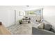 Cozy office space with a gray couch, desk, and a large window for natural light at 1186 Center Pl, Sarasota, FL 34236