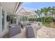 Spacious patio with comfortable seating under a large umbrella, perfect for outdoor relaxation at 1186 Center Pl, Sarasota, FL 34236