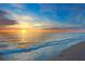Stunning sunset over the ocean, reflecting warm colors across the water and sky, creating a picturesque coastal view at 1186 Center Pl, Sarasota, FL 34236