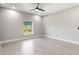 Bright bedroom featuring recessed lighting, ceiling fan, and wood-look tile flooring at 13552 Boatbill Ln, Port Charlotte, FL 33981