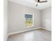 Bright bedroom featuring recessed lighting, ceiling fan, and wood-look tile flooring at 13552 Boatbill Ln, Port Charlotte, FL 33981