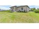 Beautiful exterior of the home with a well-manicured lawn and landscaping at 13552 Boatbill Ln, Port Charlotte, FL 33981