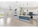 Bright open-concept kitchen and living area with modern finishes and natural light at 13552 Boatbill Ln, Port Charlotte, FL 33981