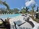 Spacious pool area with inviting lounge seating, ideal for community relaxation and recreation at 14057 Crutchfield Ct, Parrish, FL 34219