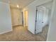Hallway features neutral carpet and bright white walls at 14057 Crutchfield Ct, Parrish, FL 34219