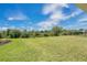Spacious backyard with lush green grass and landscaping at 16139 69Th E Ln, Parrish, FL 34219