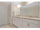 Bright bathroom features a double sink vanity with granite countertops at 16139 69Th E Ln, Parrish, FL 34219