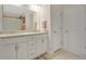 Bright bathroom features a double sink vanity with granite countertops at 16139 69Th E Ln, Parrish, FL 34219