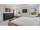 Spacious bedroom with ample natural light, modern furnishings, and serene views at 16139 69Th E Ln, Parrish, FL 34219