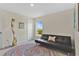 Bedroom with futon, colorful rug, and a view to the outdoors at 16139 69Th E Ln, Parrish, FL 34219
