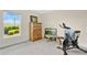 Cozy bedroom featuring exercise equipment, creating a versatile workout space at 16139 69Th E Ln, Parrish, FL 34219