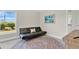 Bedroom with futon, colorful rug, and view to the outdoors at 16139 69Th E Ln, Parrish, FL 34219