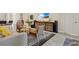 Modern living space with designer furnishings, a large TV, and a sleek console table at 16139 69Th E Ln, Parrish, FL 34219