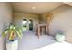 Covered patio with outdoor seating and view of green backyard at 16139 69Th E Ln, Parrish, FL 34219