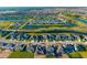 Community aerial view featuring houses, ponds, and landscaping, offering a serene and picturesque setting at 16626 Paynes Mill Dr, Lakewood Ranch, FL 34211