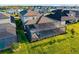 Aerial view showcasing the screened-in pool, spa and backyard within a residential community at 16626 Paynes Mill Dr, Lakewood Ranch, FL 34211