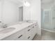 Bright bathroom with double vanity, quartz countertops, and glass enclosed shower at 16626 Paynes Mill Dr, Lakewood Ranch, FL 34211