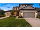 Charming two-story home featuring a three-car garage, well-manicured lawn, and inviting curb appeal at 16626 Paynes Mill Dr, Lakewood Ranch, FL 34211