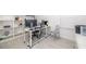 Bright home office with desk and shelving at 16626 Paynes Mill Dr, Lakewood Ranch, FL 34211