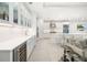 Bright, all-white kitchen with stainless steel appliances, a center island, and open layout at 16626 Paynes Mill Dr, Lakewood Ranch, FL 34211