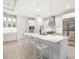 Bright kitchen featuring an island with seating, stainless steel appliances, and a modern design at 16626 Paynes Mill Dr, Lakewood Ranch, FL 34211