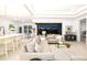 An open concept living room with modern furniture leading to a pool view at 16626 Paynes Mill Dr, Lakewood Ranch, FL 34211