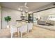 Outdoor dining with grill, stainless hood, and view of the interior living area at 16626 Paynes Mill Dr, Lakewood Ranch, FL 34211