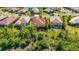 Aerial view of a well maintained home and backyard with a screened in pool at 21287 Sandal Foot Dr, Venice, FL 34293