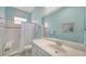 Bright bathroom featuring a white vanity, toilet, and shower with curtain at 21287 Sandal Foot Dr, Venice, FL 34293