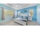 Charming bedroom featuring a large bed, a fan, and lots of natural light at 21287 Sandal Foot Dr, Venice, FL 34293