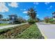Grand Palm community entrance showcasing manicured landscaping, guardhouse, and welcoming signage at 21287 Sandal Foot Dr, Venice, FL 34293