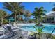 A resort-style pool area with inviting lounge chairs and shade, perfect for relaxation and recreation at 21287 Sandal Foot Dr, Venice, FL 34293