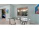 View of the dining area with glass table with backyard view with patio seating at 21287 Sandal Foot Dr, Venice, FL 34293