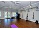 Well-equipped gym with modern fitness gear including a climbing rack, weights, and yoga mats at 21287 Sandal Foot Dr, Venice, FL 34293