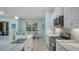 Well-equipped kitchen features modern stainless steel appliances, marble countertops, and backsplash at 21287 Sandal Foot Dr, Venice, FL 34293