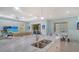 Open concept kitchen view showcases a large sink and seamlessly connects to the living and dining areas at 21287 Sandal Foot Dr, Venice, FL 34293