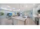 Spacious kitchen that opens into the living room and dining area for seamless entertaining at 21287 Sandal Foot Dr, Venice, FL 34293